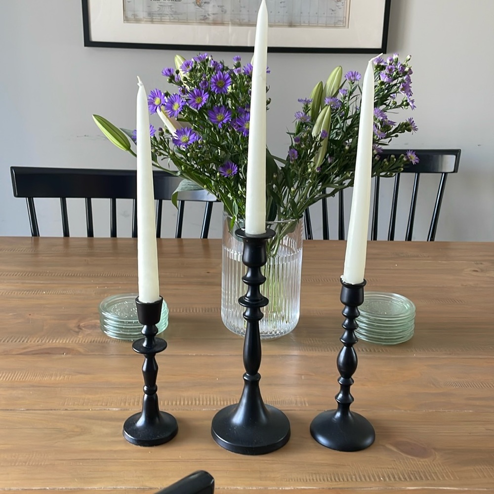 Set of three black, metal candlestick holders